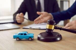 Judge,Gavel,And,Miniature,Car,Symbolize,Auction,Or,Court,Case